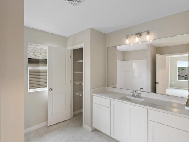 bathroom featuring vanity and tile patterned flooring