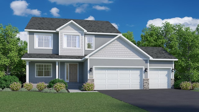 craftsman-style house featuring a garage, driveway, a front lawn, and a shingled roof