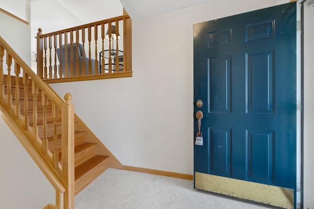 entryway featuring baseboards