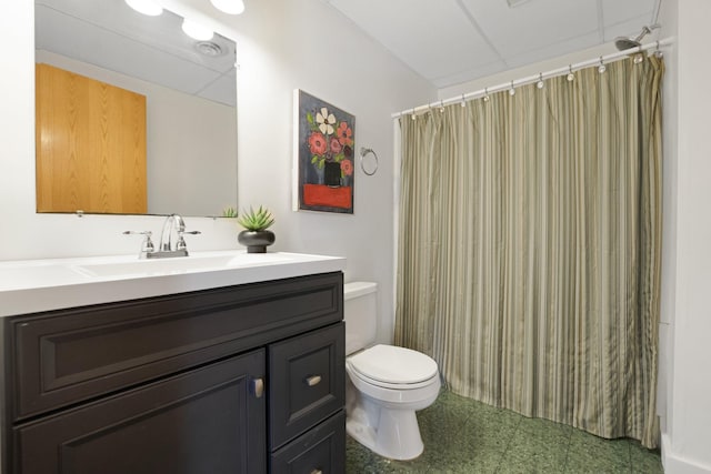 full bathroom featuring vanity, tile patterned floors, toilet, and curtained shower