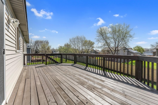 wooden deck featuring a residential view