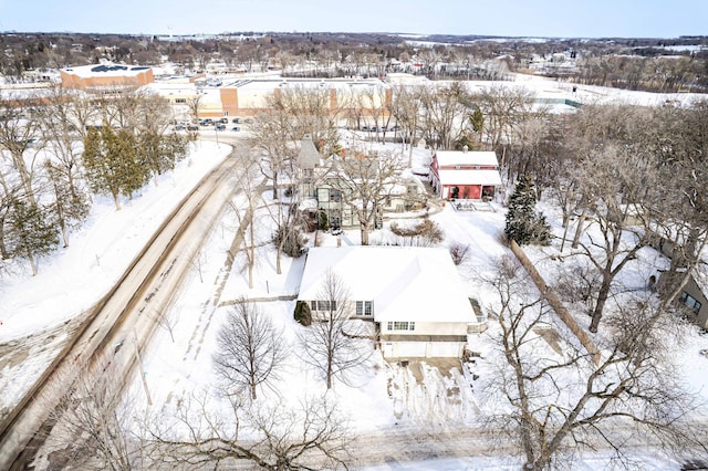 snowy aerial view featuring a residential view