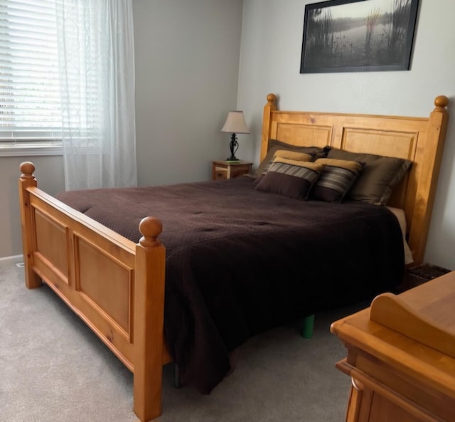 bedroom with light carpet