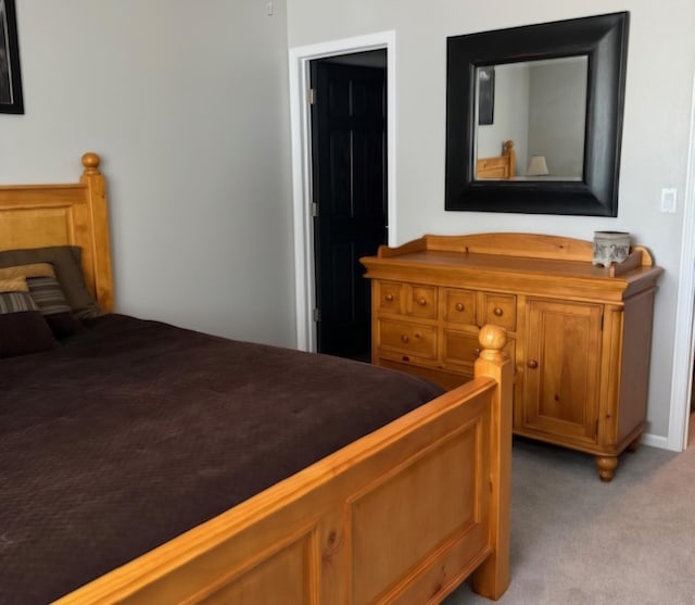 bedroom featuring light carpet