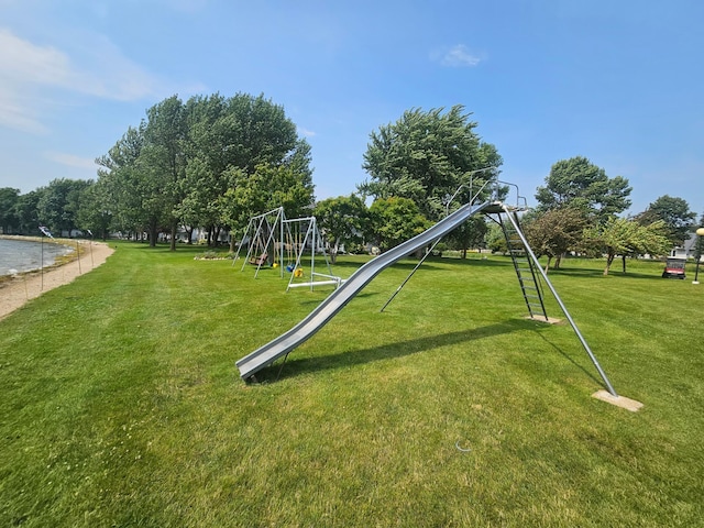 community jungle gym with a lawn