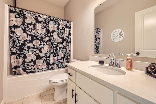 full bath with tile patterned floors, shower / bath combo with shower curtain, toilet, and vanity