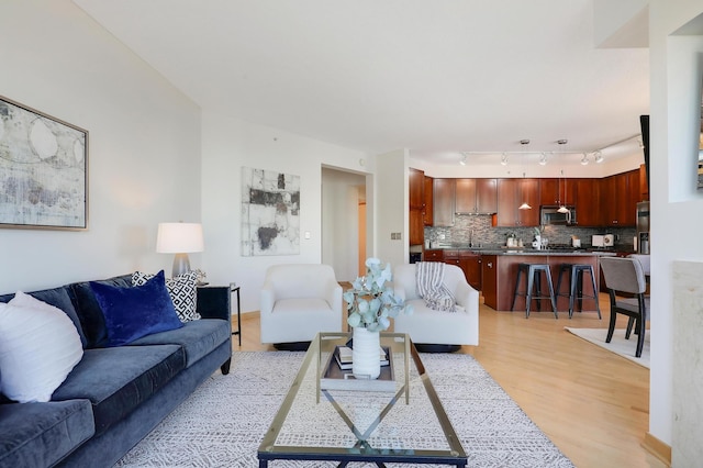 500 Grant St Unit 1302, Minneapolis, MN 55404 - living area with track lighting and light wood-style flooring