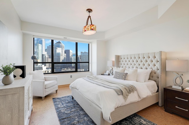 500 Grant St Unit 1302, Minneapolis, MN 55404 - bedroom featuring a view of city, visible vents, and light colored carpet