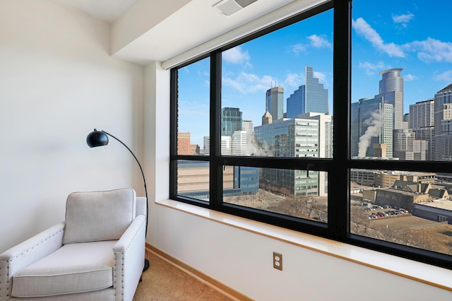 500 Grant St Unit 1302, Minneapolis, MN 55404 - living area with baseboards, a view of city, carpet floors, and visible vents