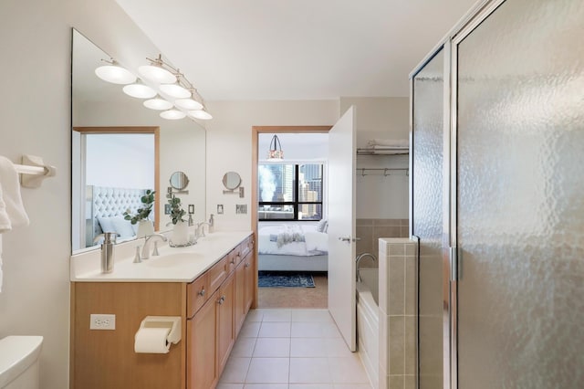 500 Grant St Unit 1302, Minneapolis, MN 55404 - ensuite bathroom featuring a sink, a shower with shower door, tile patterned flooring, double vanity, and ensuite bathroom