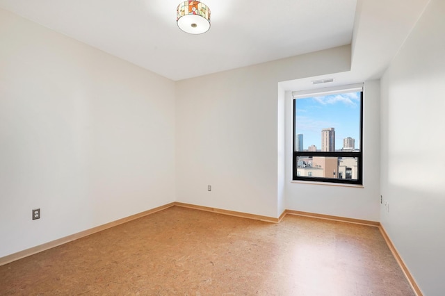 500 Grant St Unit 1302, Minneapolis, MN 55404 - spare room with baseboards and visible vents