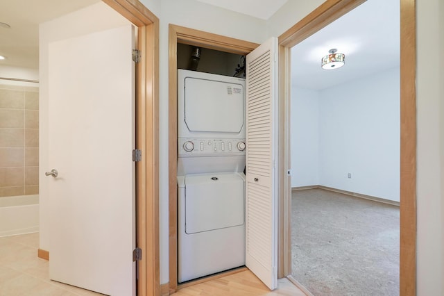500 Grant St Unit 1302, Minneapolis, MN 55404 - laundry area with stacked washer and clothes dryer, recessed lighting, and laundry area