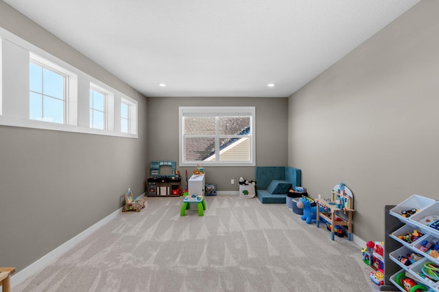 game room with light carpet, recessed lighting, and baseboards