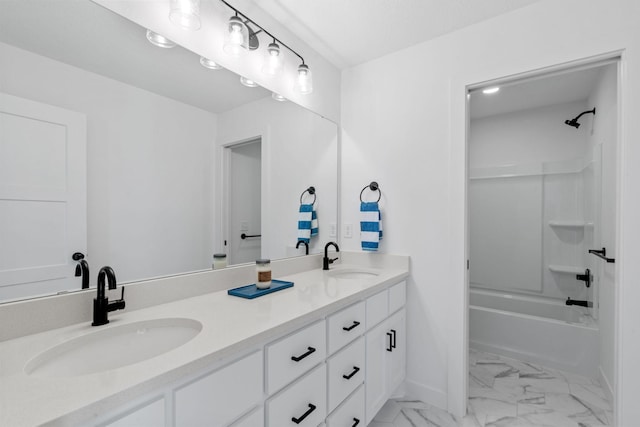 full bath with bathtub / shower combination, marble finish floor, a sink, and double vanity