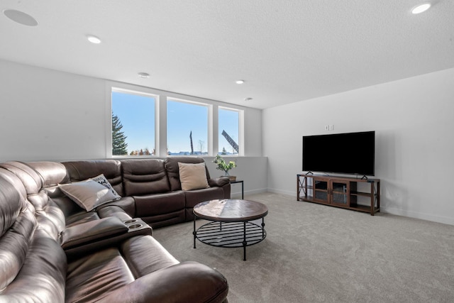 living room with recessed lighting, baseboards, and light colored carpet