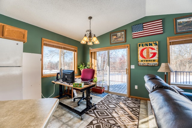 office space featuring vaulted ceiling, a notable chandelier, a textured ceiling, and baseboards