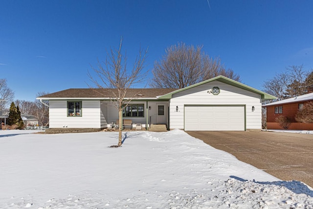 single story home featuring a garage and driveway