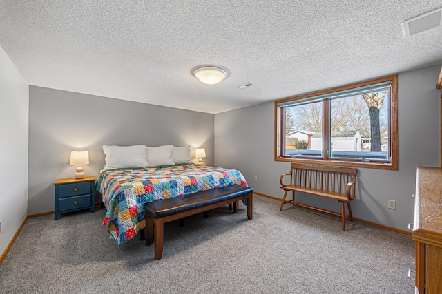 bedroom with a textured ceiling, baseboards, and carpet flooring