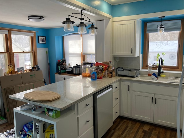 kitchen featuring light stone counters, open shelves, hanging light fixtures, white cabinets, and a peninsula