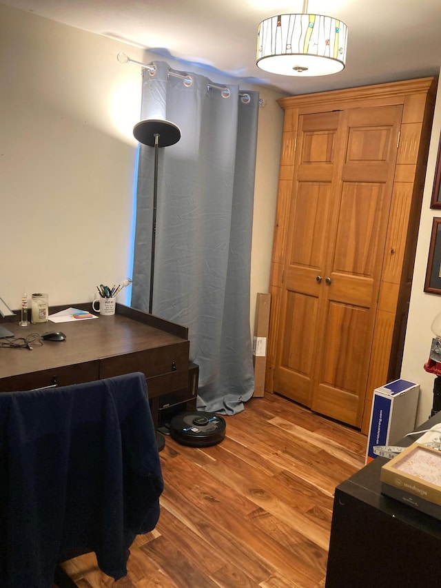 home office with light wood-style floors