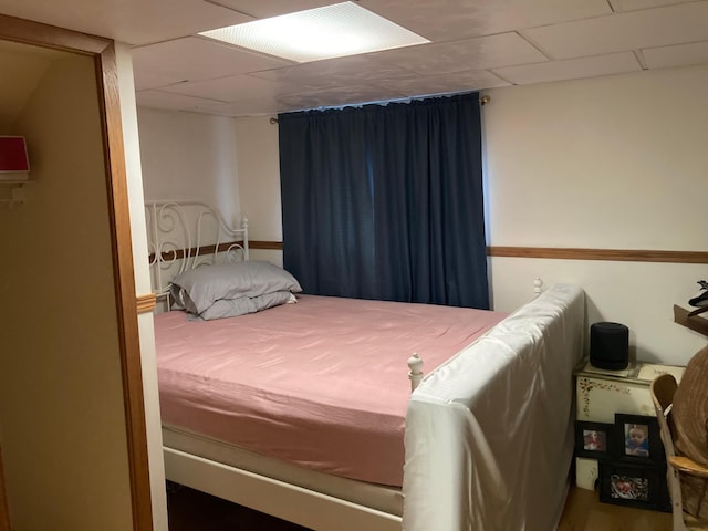 bedroom featuring a paneled ceiling