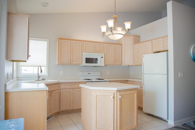 kitchen featuring decorative light fixtures, light countertops, light brown cabinets, a kitchen island, and white appliances