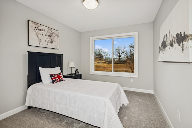 carpeted bedroom with baseboards