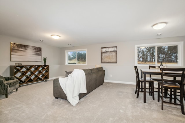 living room featuring carpet floors and baseboards