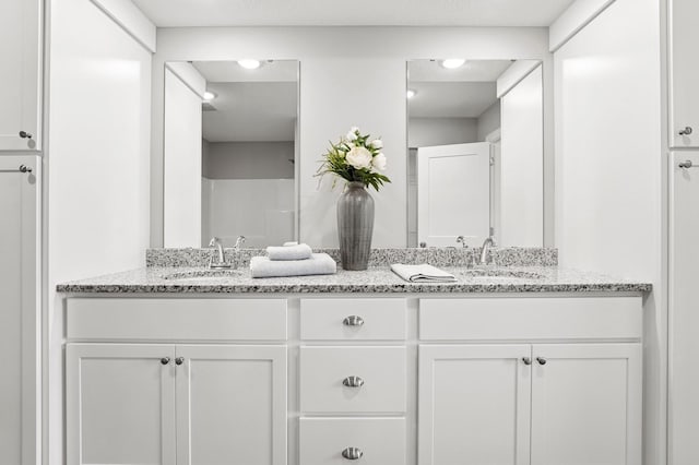 bathroom with double vanity and a sink