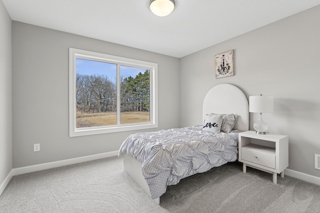 bedroom with carpet and baseboards