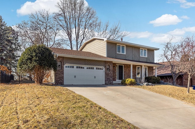 traditional home with a front yard, brick siding, fence, and an attached garage