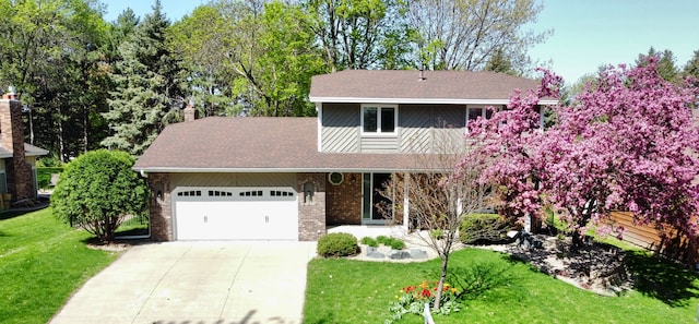 7879 Juneau Ln N, Maple Grove, MN 55311 - traditional-style home with concrete driveway, a garage, a front lawn, brick siding, and a shingled roof