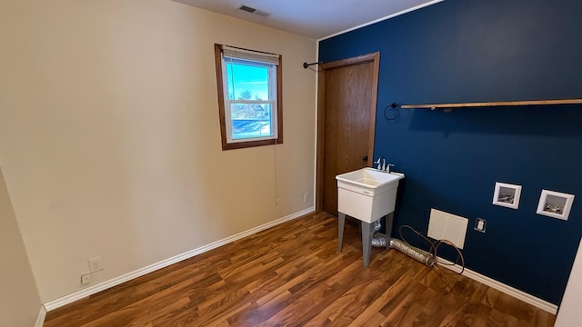 washroom with laundry area, visible vents, washer hookup, and wood finished floors