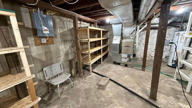 unfinished basement featuring electric panel, heating unit, and water heater