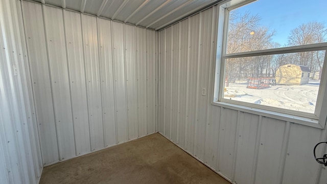 spare room with concrete flooring