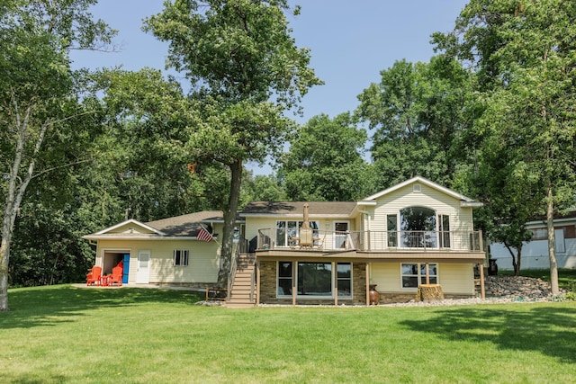 view of front of property with stone siding, stairway, a front yard, and a wooden deck