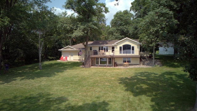 exterior space with a wooden deck, a front lawn, and stairs