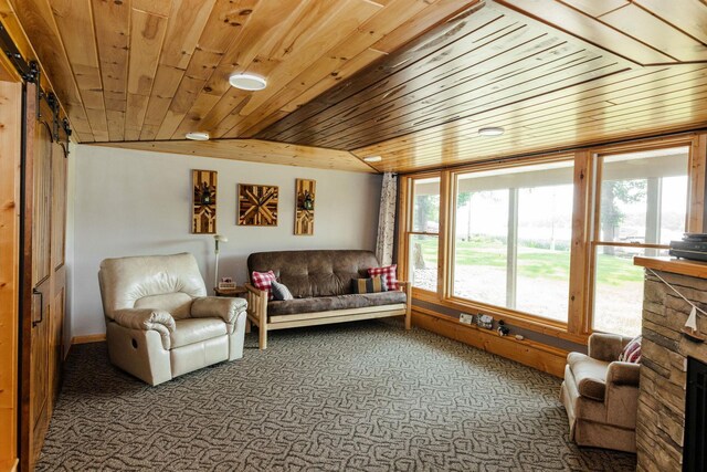 interior space with carpet, wood ceiling, and a fireplace