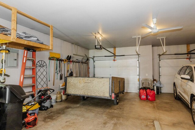 garage with electric panel, a ceiling fan, and a garage door opener