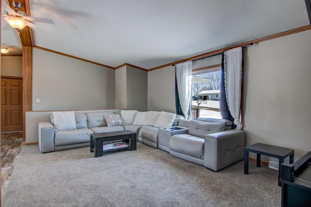 carpeted living room featuring ceiling fan and ornamental molding