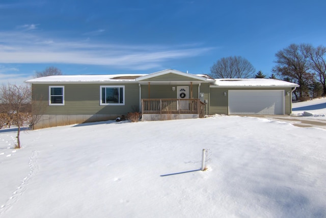 view of front of home with a porch and a garage