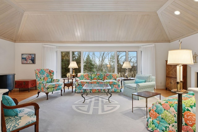 living room featuring wood finished floors, wood ceiling, a fireplace, and vaulted ceiling with beams