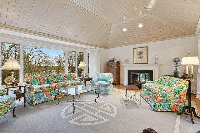 living area featuring recessed lighting, wood ceiling, a glass covered fireplace, and vaulted ceiling