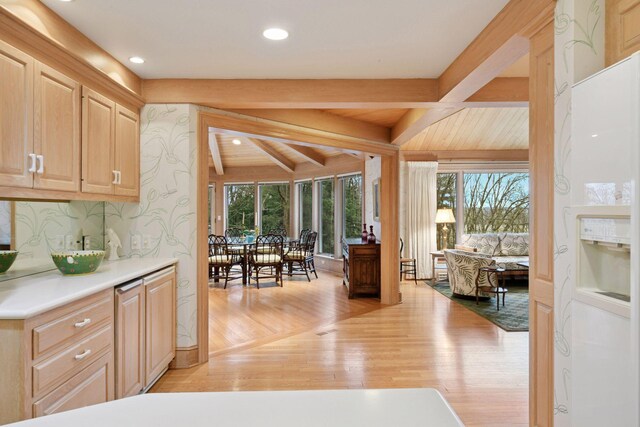 kitchen with light countertops, plenty of natural light, light wood finished floors, and light brown cabinetry