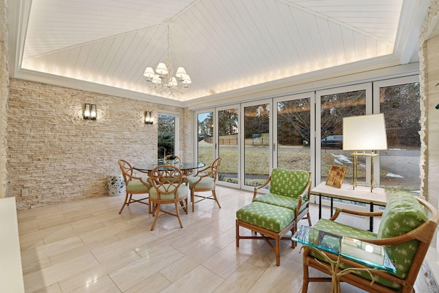 sunroom / solarium featuring a tray ceiling, lofted ceiling, a chandelier, and wooden ceiling