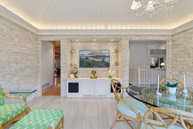 interior space featuring crown molding, wood finish floors, wooden ceiling, and a chandelier