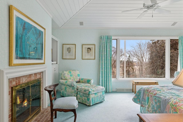 bedroom with visible vents, a tile fireplace, wooden ceiling, carpet flooring, and vaulted ceiling