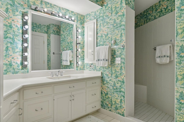 full bath with wallpapered walls, tile patterned floors, vanity, and walk in shower