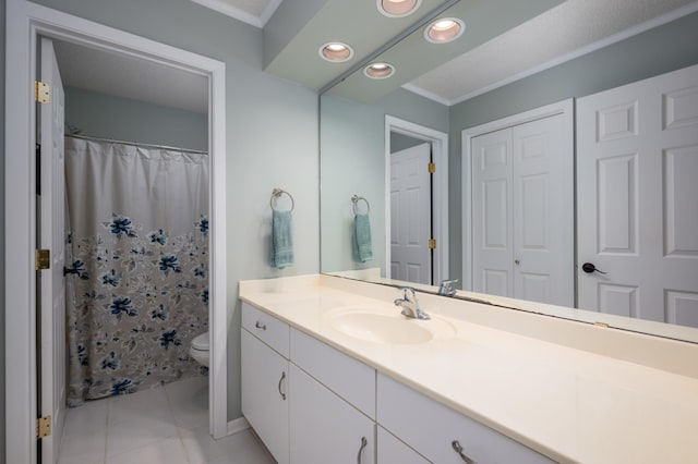 bathroom featuring vanity, recessed lighting, tile patterned flooring, crown molding, and toilet