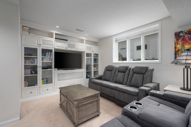 living room featuring recessed lighting, light colored carpet, a textured ceiling, and baseboards